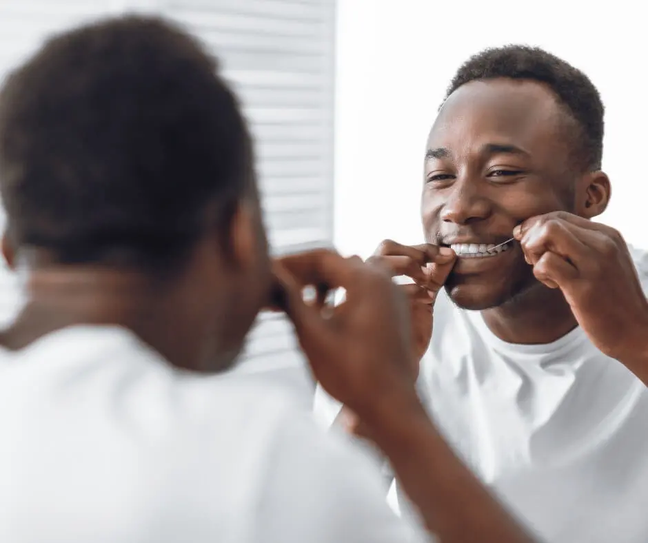 Man Flossing Teeth